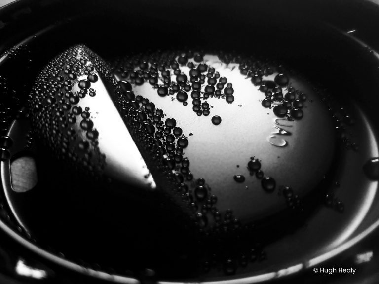 Droplets in a coffee cup lid