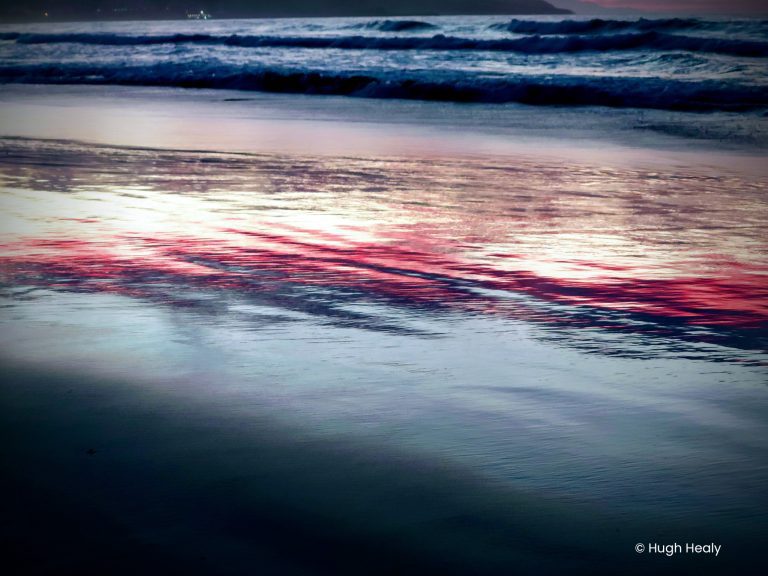Dusk colours reflecting on the shore