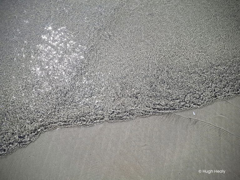 A sea filled with diamonds washes onto the shore